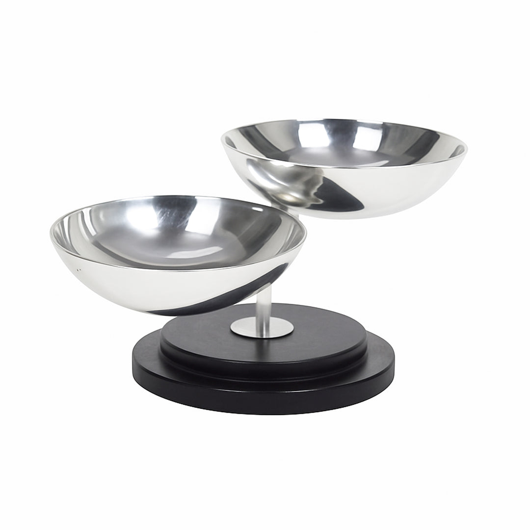 Swinging Nut Bowl balances a hemispherical silver bowl on a slim stem that pivots on a ball joint - angle 3