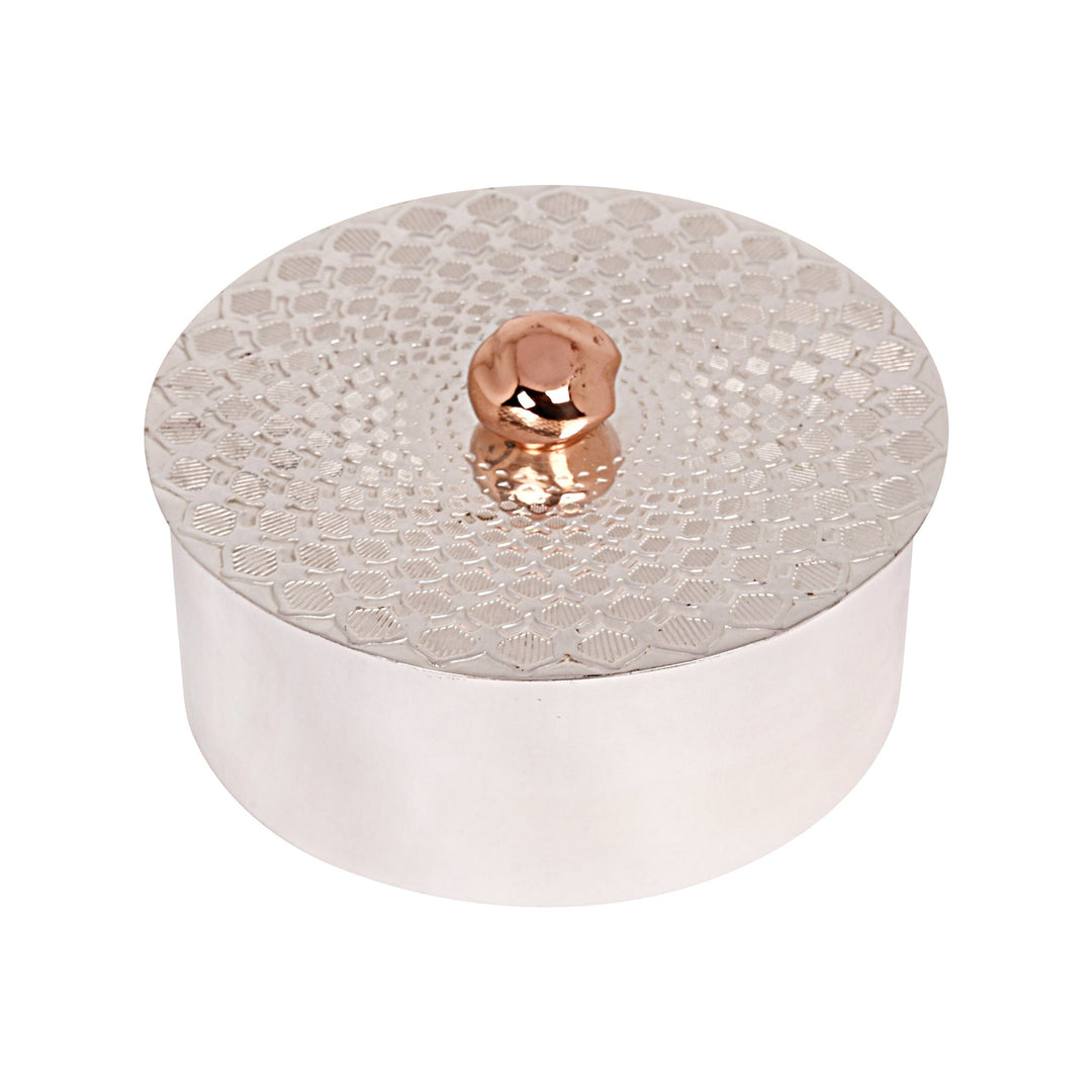 Box Round Illusion is a round silver box with a honeycomb texture pressed across its lid, topped with a smooth copper-toned ball as its knob - white background