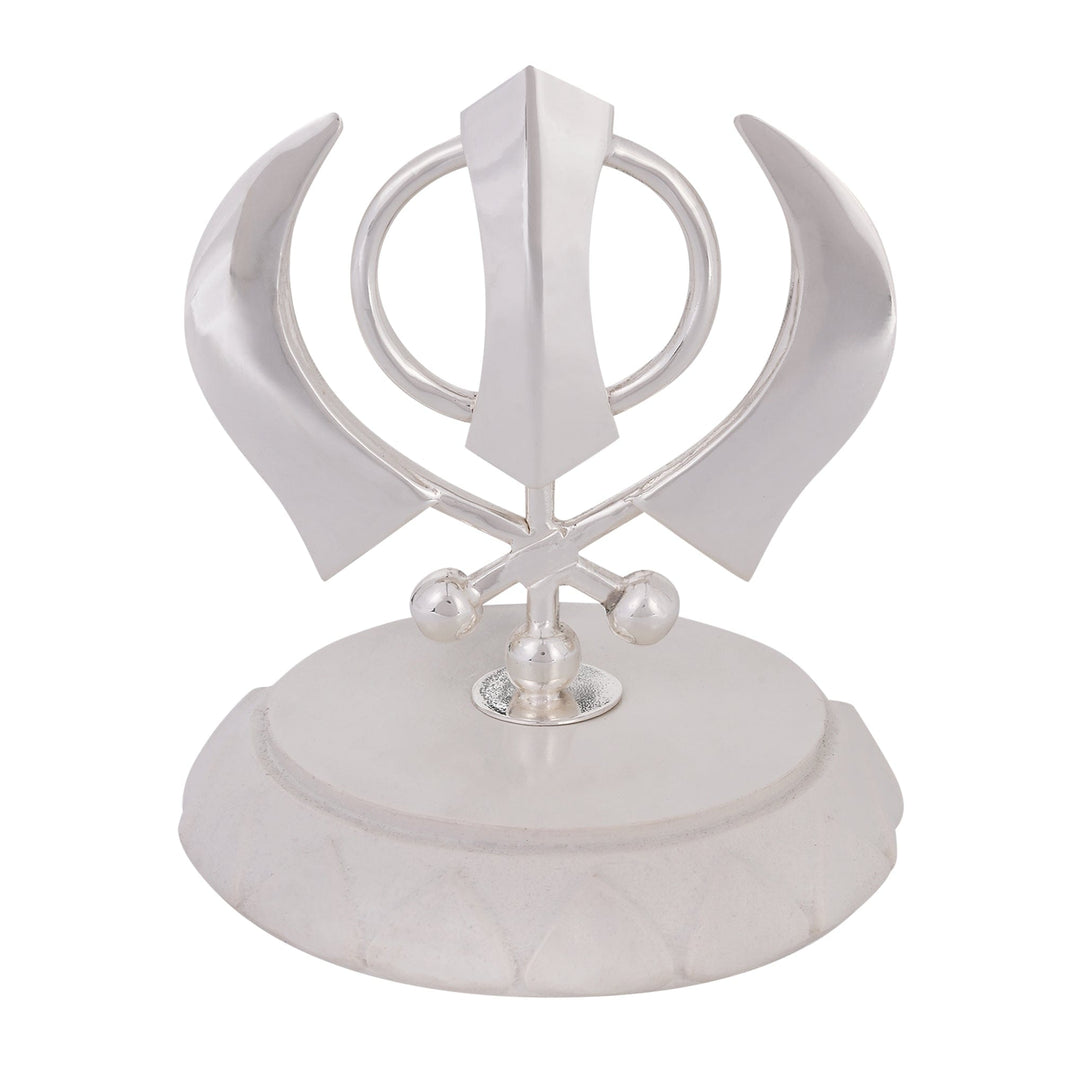 Khanda Sahib on Base is a silver emblem of the Khanda Sahib, the defining symbol of Sikh faith, rising from a faceted ivory stone base - white background