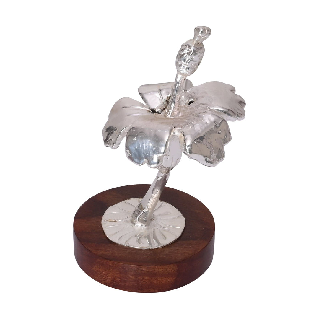 Hibiscus Incense Holder is a silver incense holder shaped as a hibiscus flower opening on a slim stem - white background