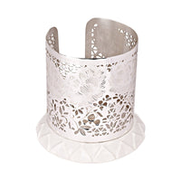 Flower Votive is a silver votive wrapped in a row of layered petals around its base, each cut opening - angle 4
