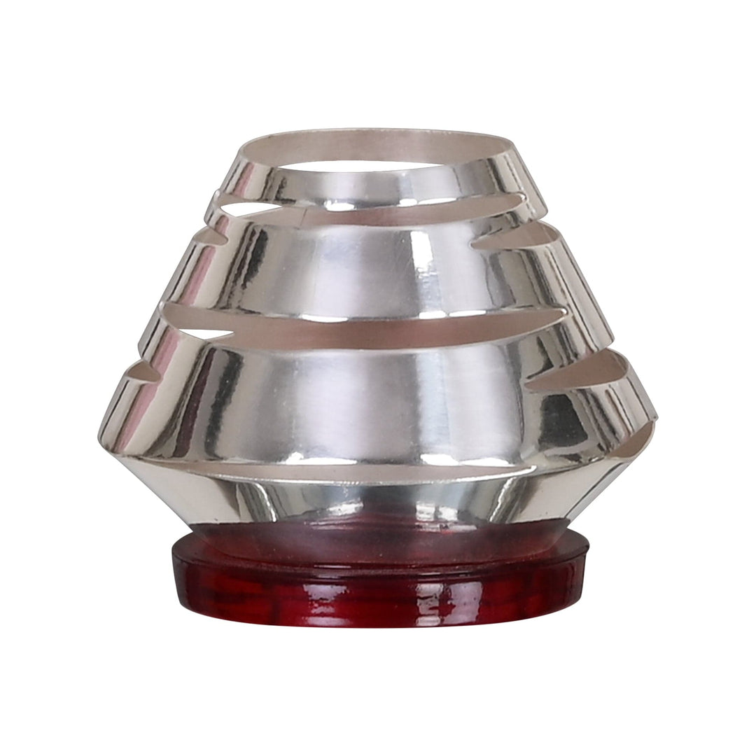 Zebra Votive is a faceted silver candle stand with a stepped, angular silhouette - white background