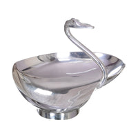 Heart Swan Bowl is a heart-shaped silver bowl that lifts a swan's curved neck and head from its rim - white background