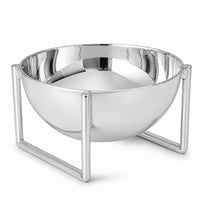 Arco Nut Bowl is a silver nut bowl, a mirror polished hemisphere held clear of the table in a squared open frame - white background