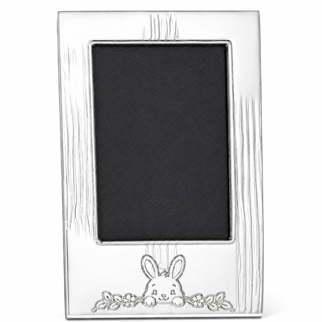Bunny Bloom Photo Frame is a silver photo frame with engraved reed bands and an embossed bunny rising from a flower garland below the aperture - white background