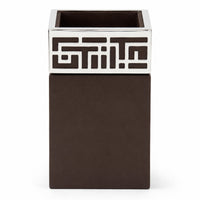 Enigma Penstand is a silver pen stand with a geometric maze fretwork collar around the rim of a square dark wood cup. - white background