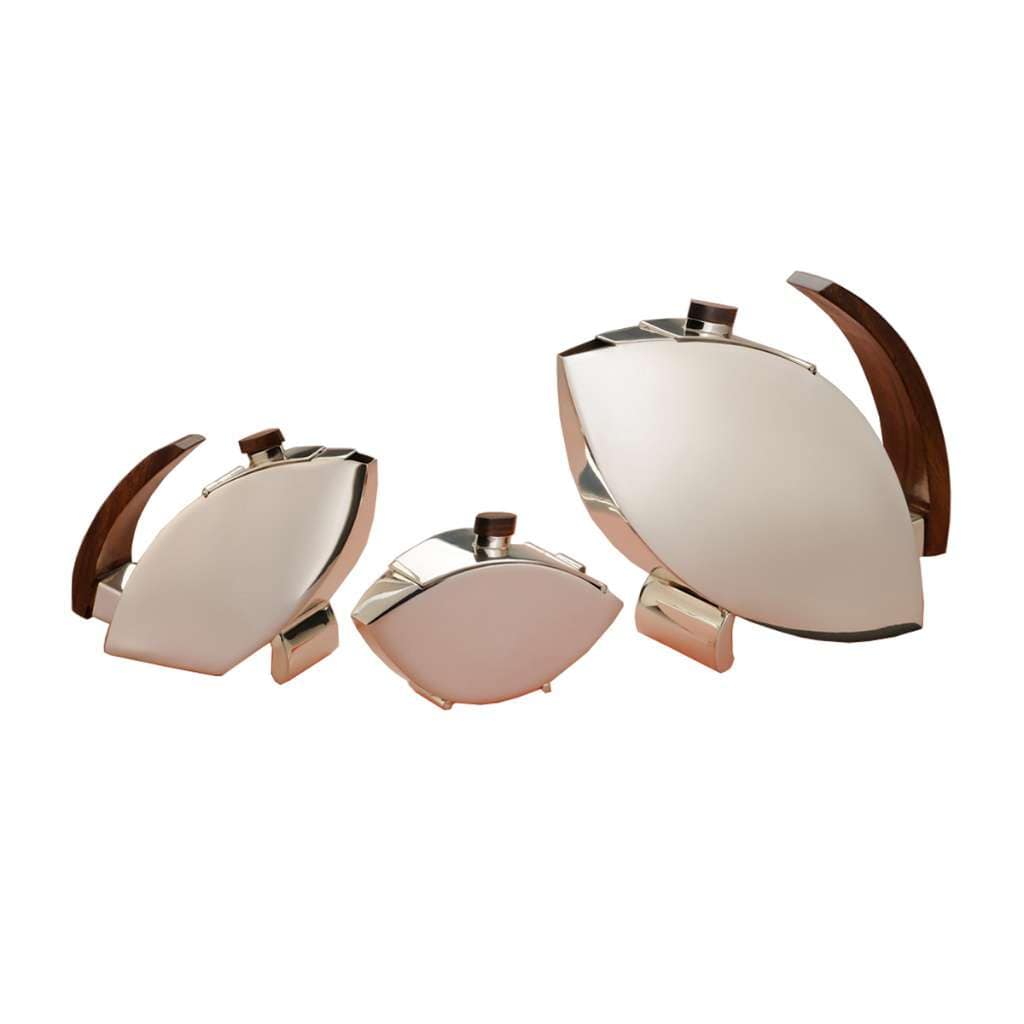 Tea Set Pisces is a silver teapot, creamer, and sugar bowl trio arranged in three graduated, leaf-shaped sizes - white background