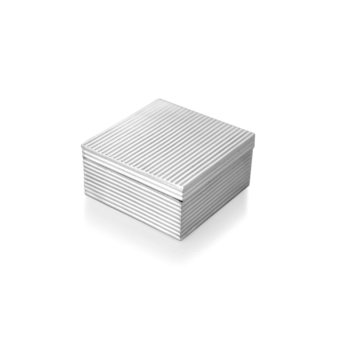 Box Ribbed Square is a silver box with a square, cube-like form that places it in Episode&