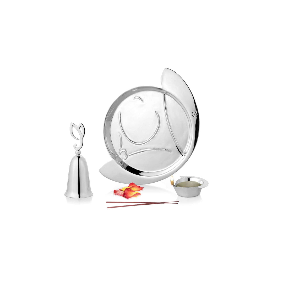 Pooja Thali Vinayak is an oval, leaf-shaped silver thali with a raised rim and Ganesha&