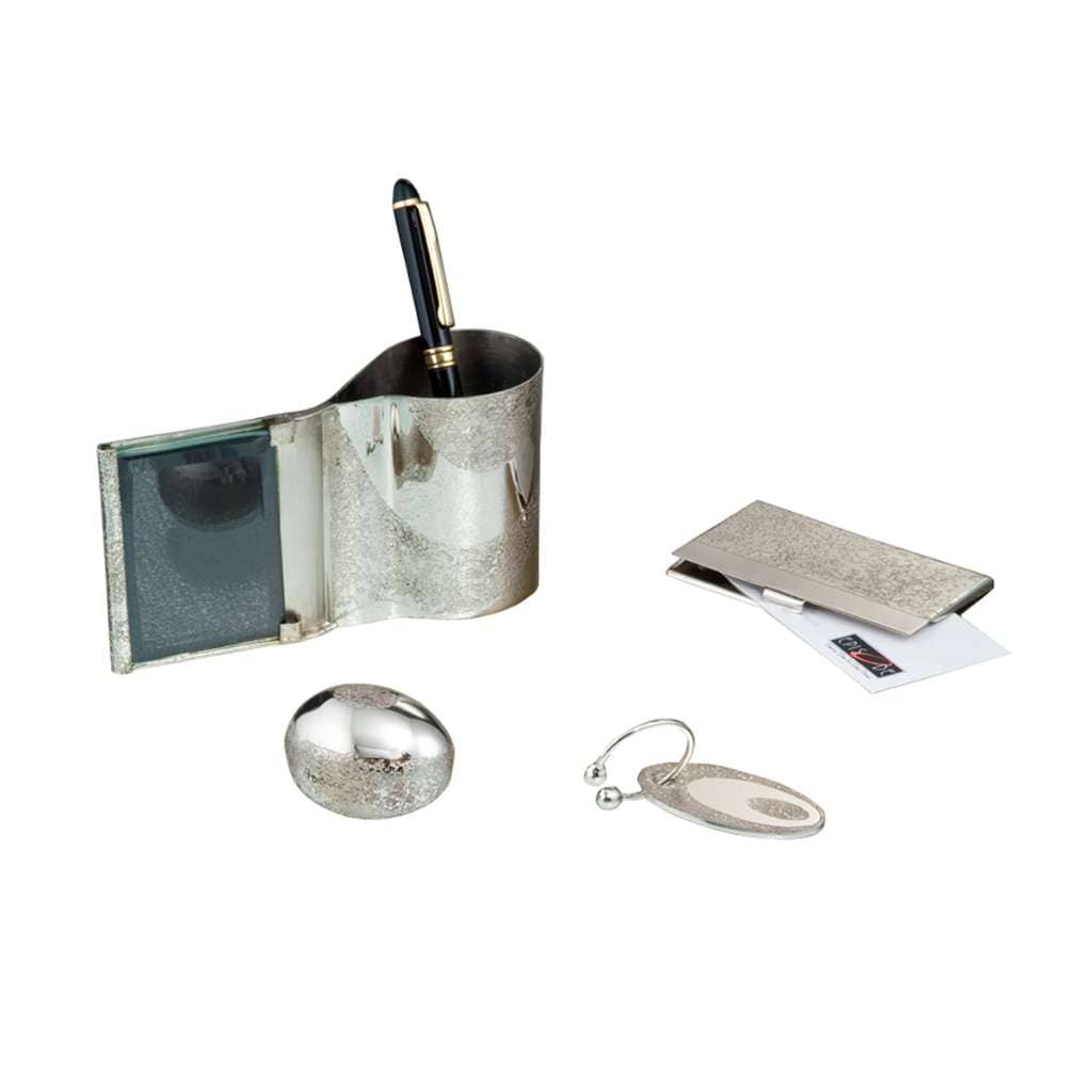 Office Set Surpass brings together four silver desk essentials: a pen stand with a small photo frame built into its side - white background