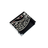 Memo Pad Iris Trails is a silver memo pad fronted with a curved panel cut in a trailing iris pattern - white background