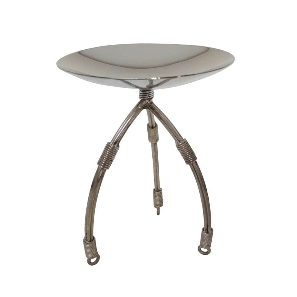 Bowl Candy Dish Tripod is a simple, shallow silver bowl that sits atop three spring-coiled legs splaying outward from a central column - white background