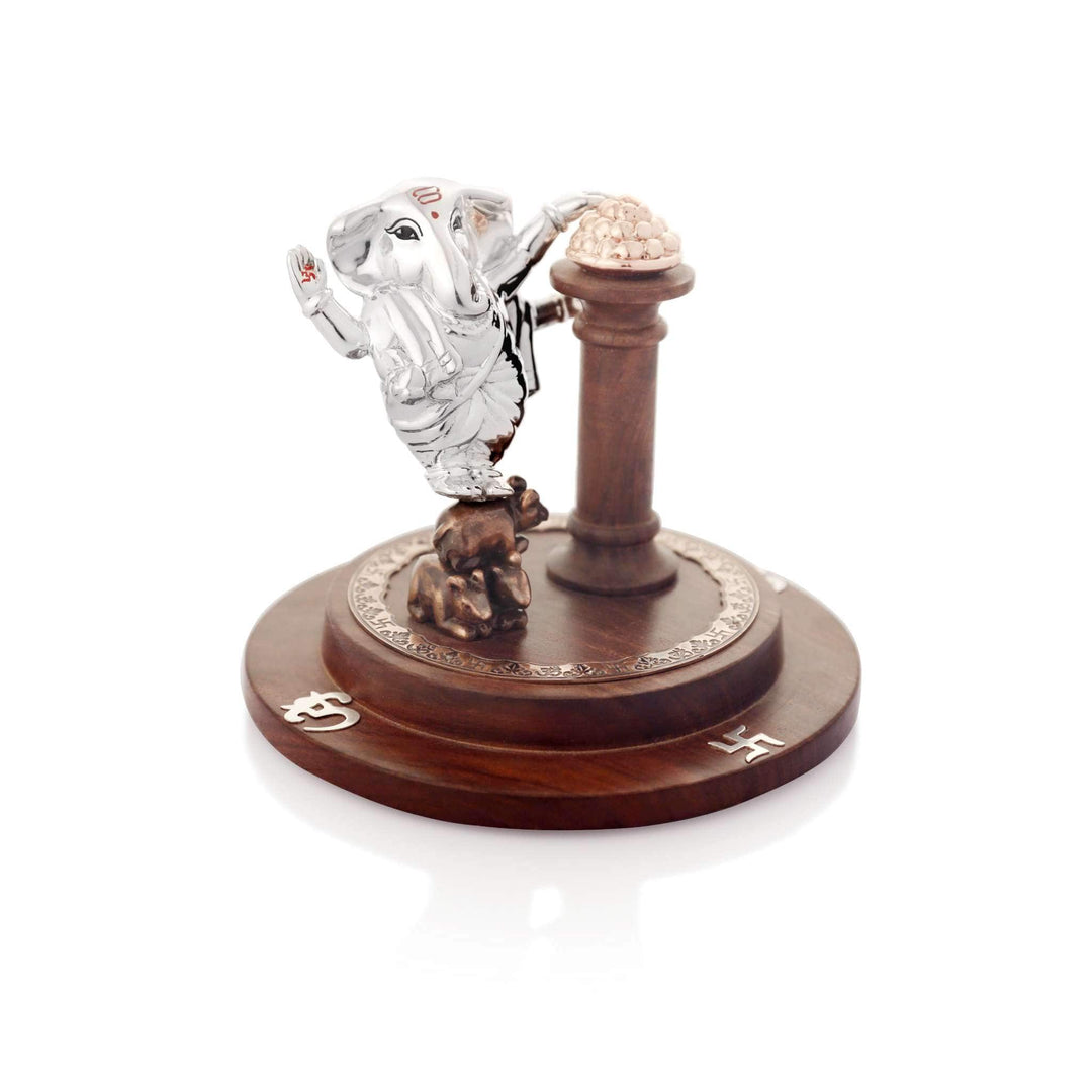 Ganesh Chulbul catches a sterling silver Ganesha idol mid-dance - white background