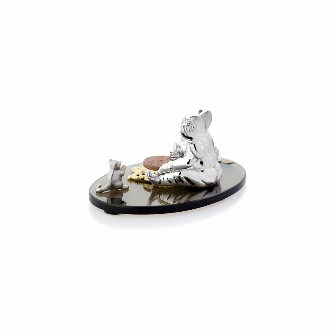 Ganesh Vaibhav Chintamani shows a four-armed sterling silver Ganesha idol raising one palm with a painted Om symbol in blessing - white background