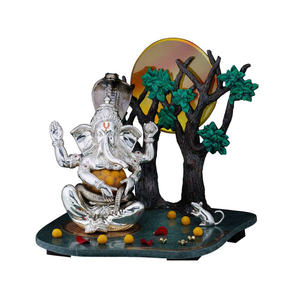 Ganesh Sampoorna seats a silver Ganesha idol beneath a sacred tree with a hooded cobra above his head, a small mouse companion and scattered laddus completing the scene on a marble base - white background