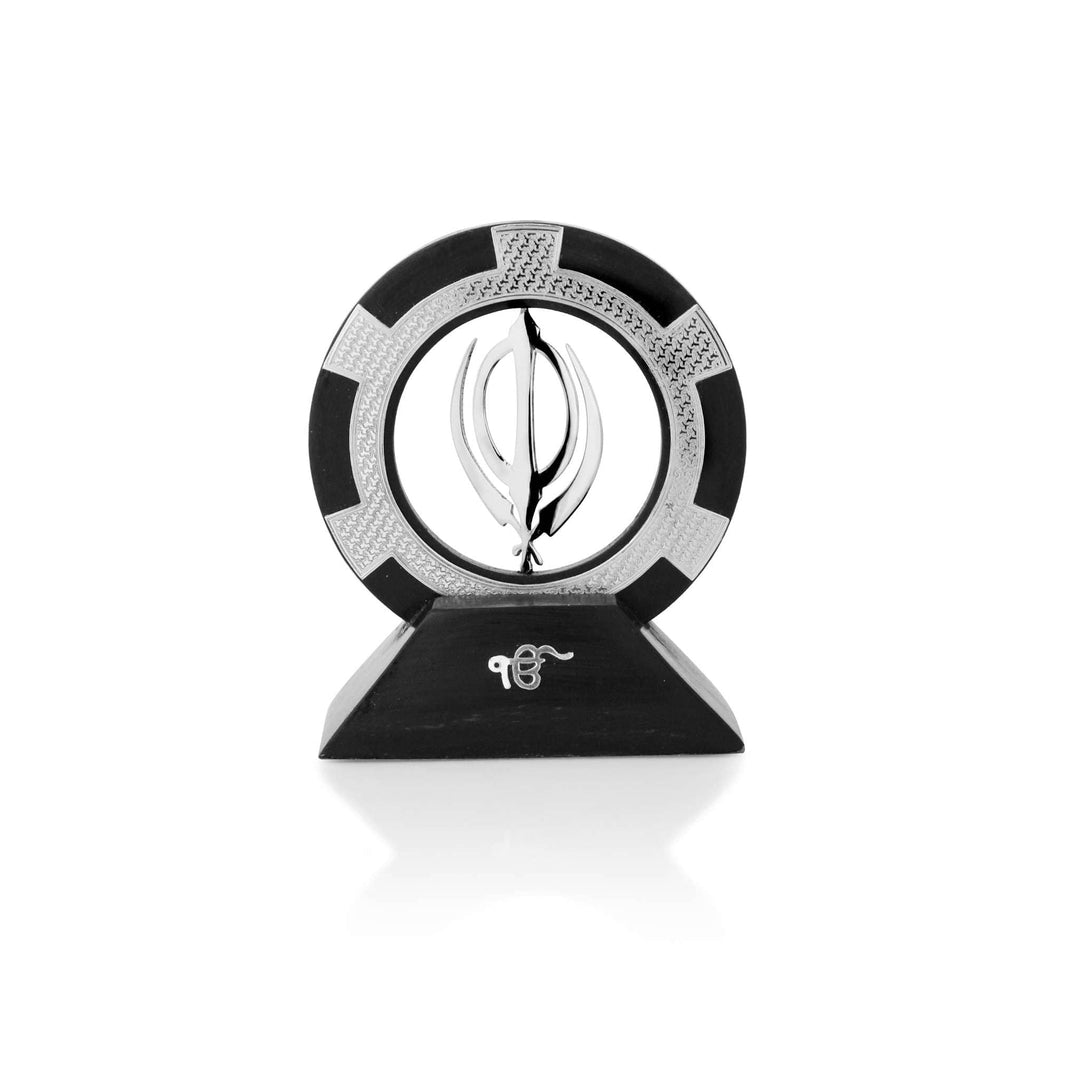 Khanda Sahib With Wood sets a sterling silver Khanda Sahib emblem inside a textured black and silver ring - white background