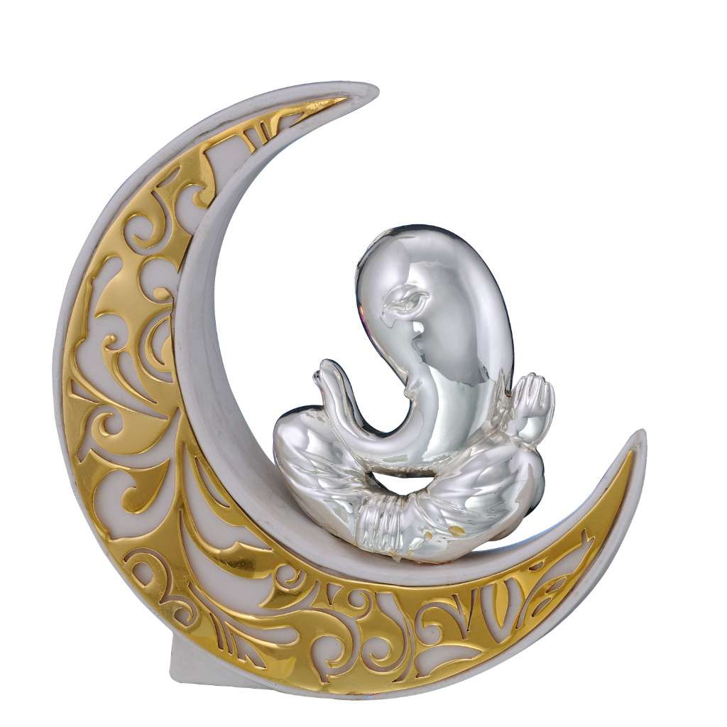 Ganesh Chandrama sets a sterling silver Ganesha idol with hands folded in the curved crook of a crescent moon rendered in white enamel with dense gold scrollwork - white background