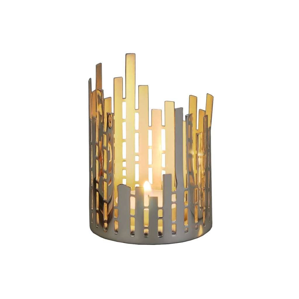 Tea Lights Holder Lamela is a silver tea light holder that builds a modern skyline silhouette from irregular vertical bars of uneven heights – Small