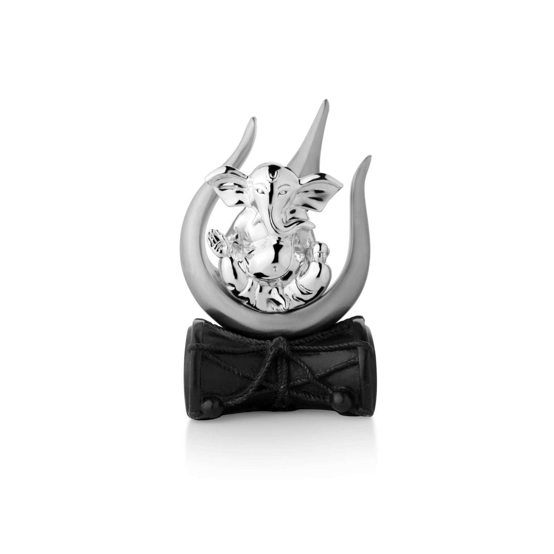 Ganesh Shivpriya cradles a sterling silver Ganesha idol within the sweeping curve of Shiva&