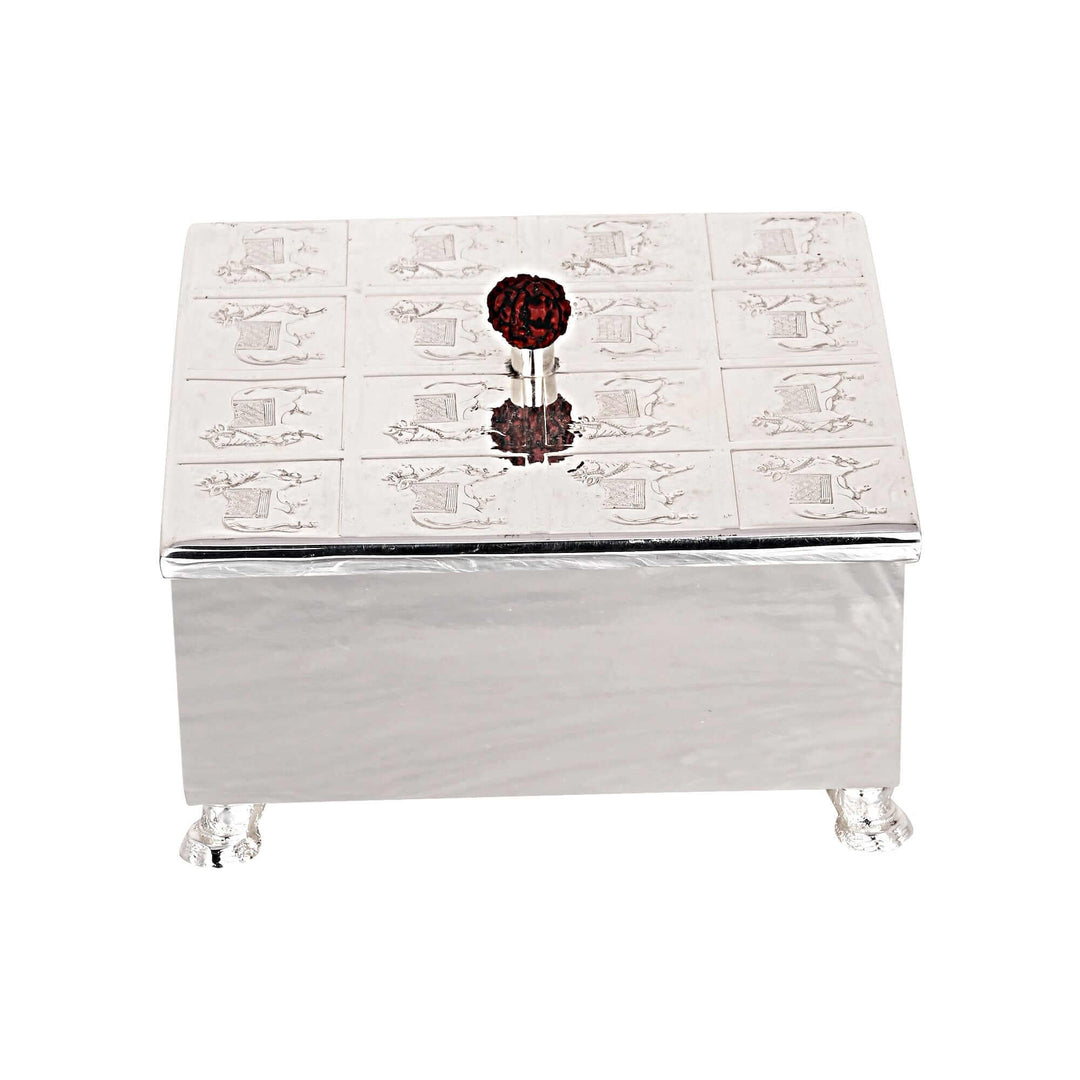 Box Cow With Feet is a silver box with a lid covered in rows of engraved cow figures, each one framed in its own small panel - white background