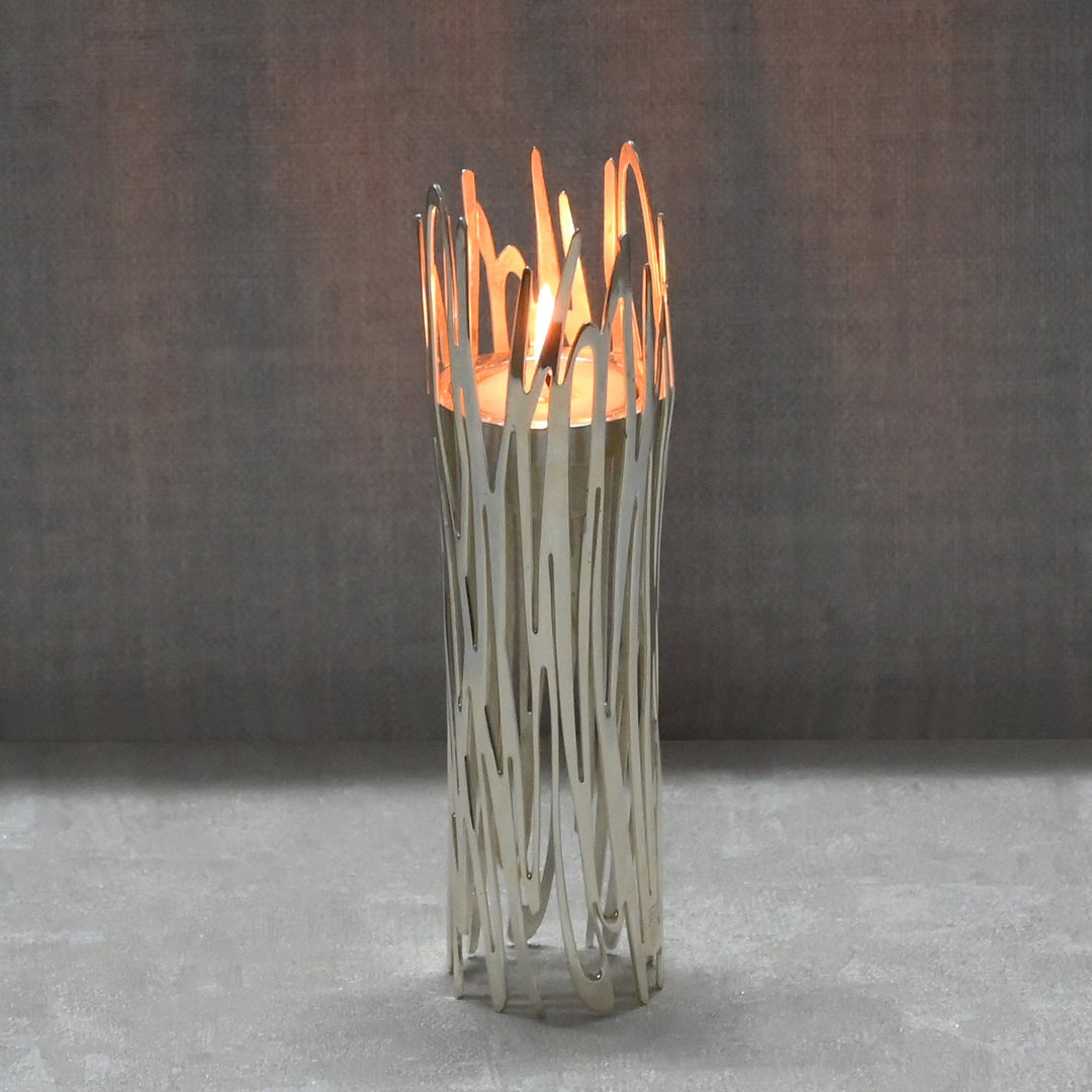Silver Plated Candle Stand Graffiti is a silver candle stand weaving ribbon-like strips of polished metal into an organic – Large