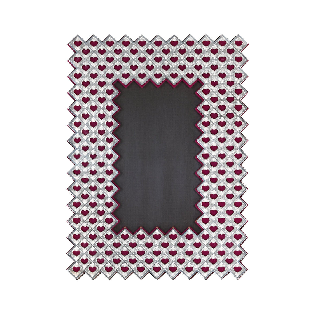 Heart Photoframe is a silver photoframe with a heart-shaped silhouette and a diamond quilted border - white background