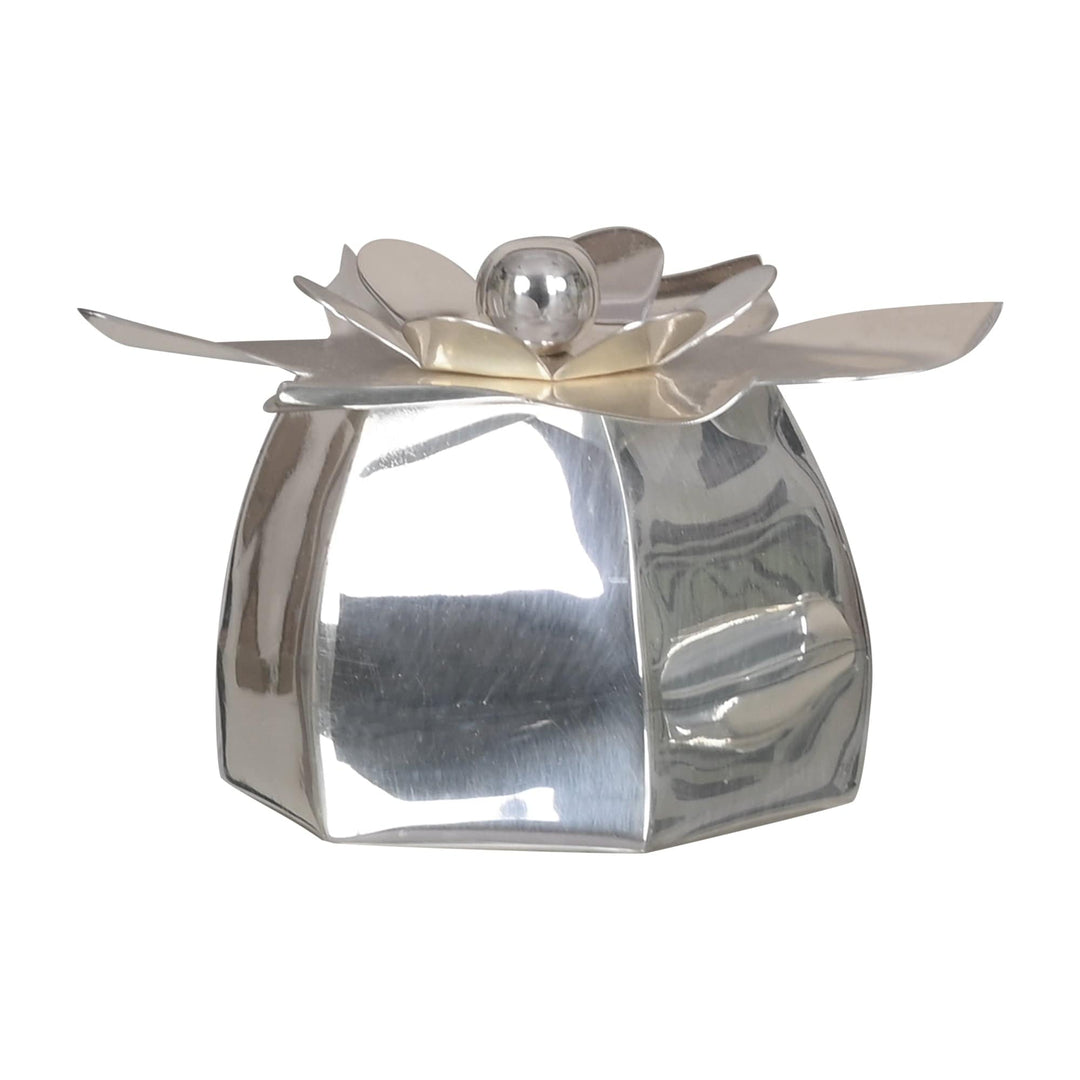 Flower Box is a silver box whose octagonal walls taper up from a gathered gift-pouch shape to an open top framed by a sculptural flower - white background