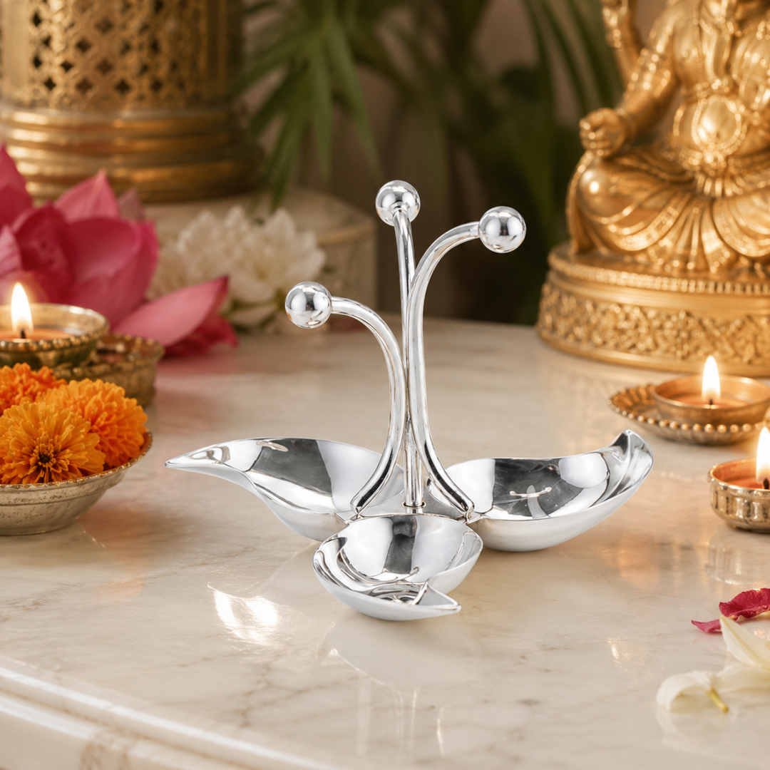 Diya Agni gathers three or five leaf-shaped wick cups around a central stem, each leaf tipped - angle 2