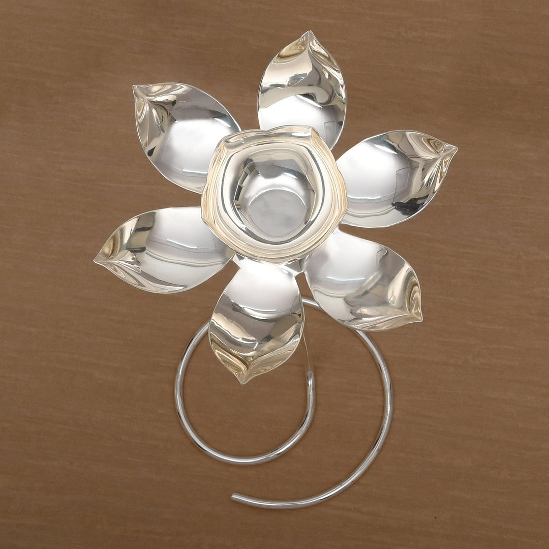 Lotus on Stand is a silver candle stand shaped as a lotus flower opening atop a slim rod – Medium