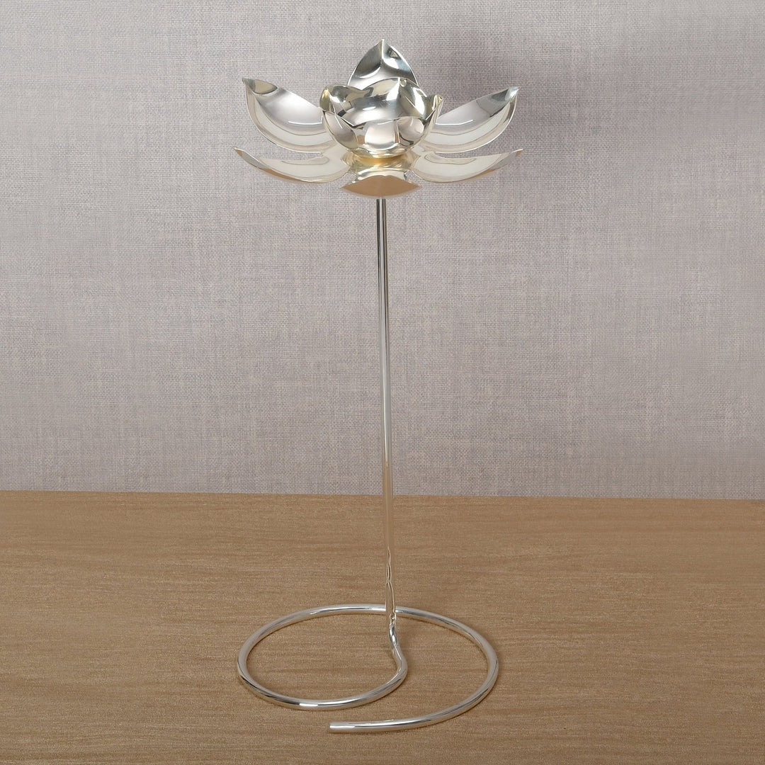Lotus on Stand is a silver candle stand shaped as a lotus flower opening atop a slim rod - angle 3