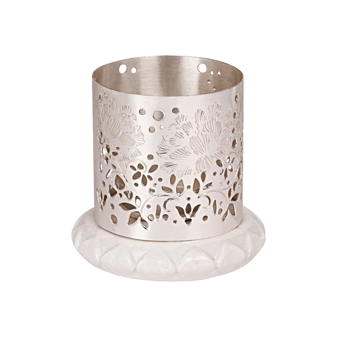 Flower Votive is a silver votive that wraps a row of layered petals around its base – Small
