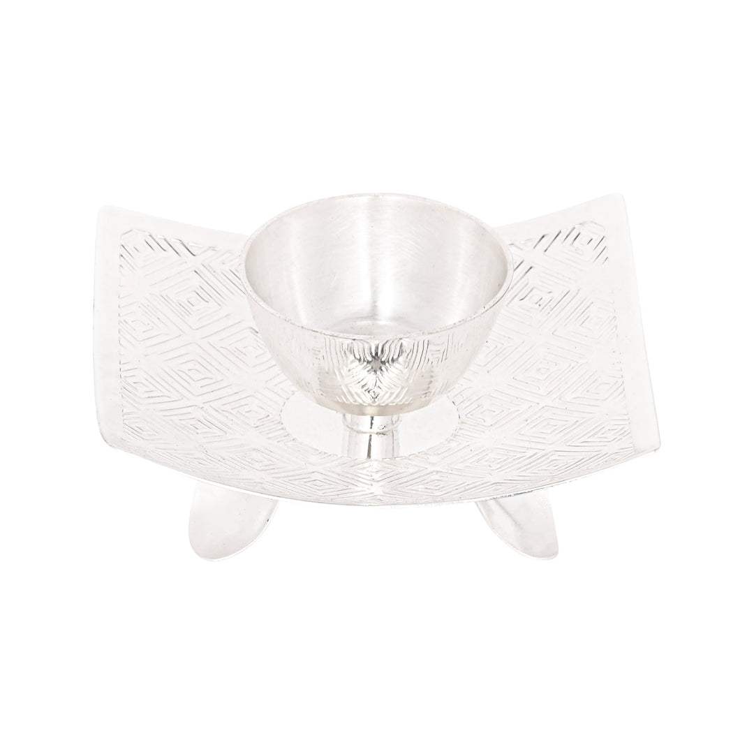 Signature T Light Holder Square is a silver t-light holder centring a small diamond-shaped bowl on a square - white background