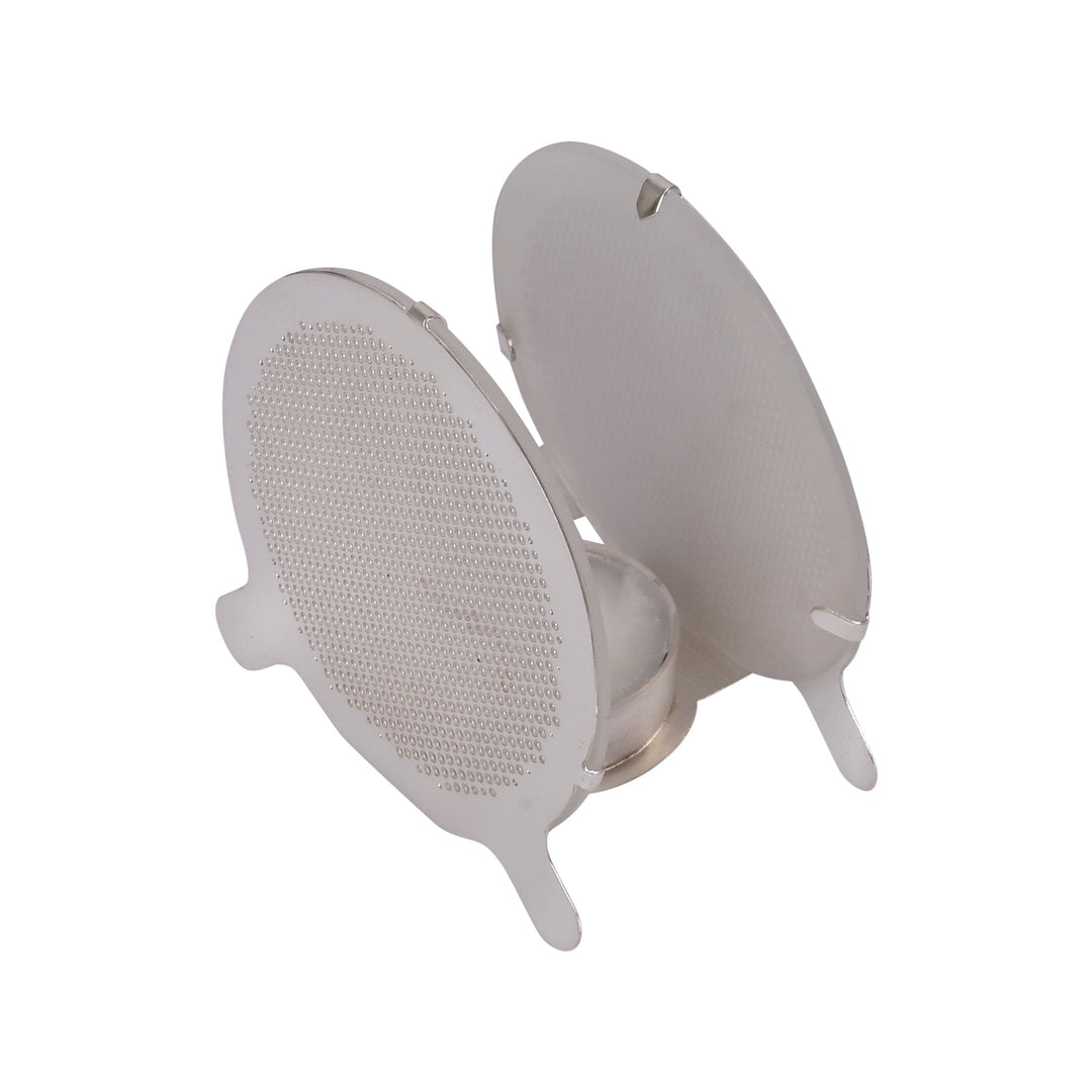 Moth T-Light is a silver t-light holder made of two oval discs, each pierced with a fine repeating dot pattern - white background