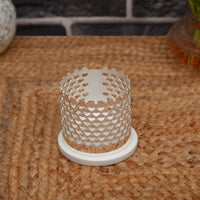 Heart Votive is a cylindrical silver candle stand pierced all over with a dense heart lattice, so a lit tealight throws a soft - angle 2