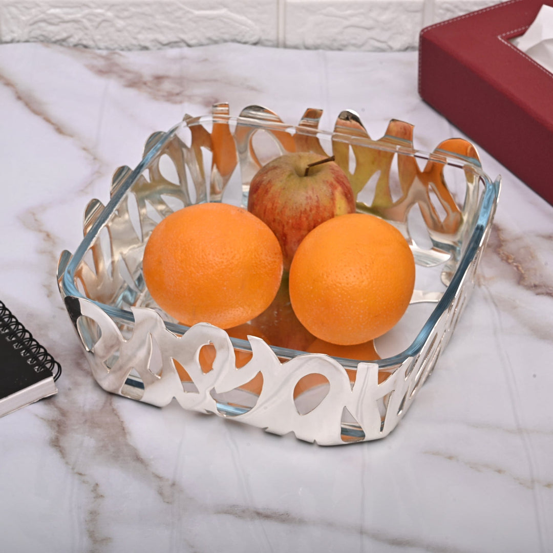 Bowl Square Graffiti wraps a bold, graffiti-style pierced pattern around a clear glass insert in this square silver bowl – Large