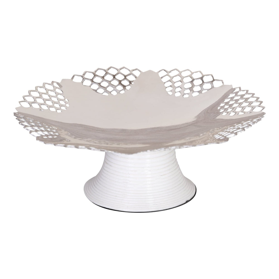 Splash Jyot Dish is a silver cake-stand-style dish with a scalloped, honeycomb-pierced rim raised on a ribbed pedestal foot - white background