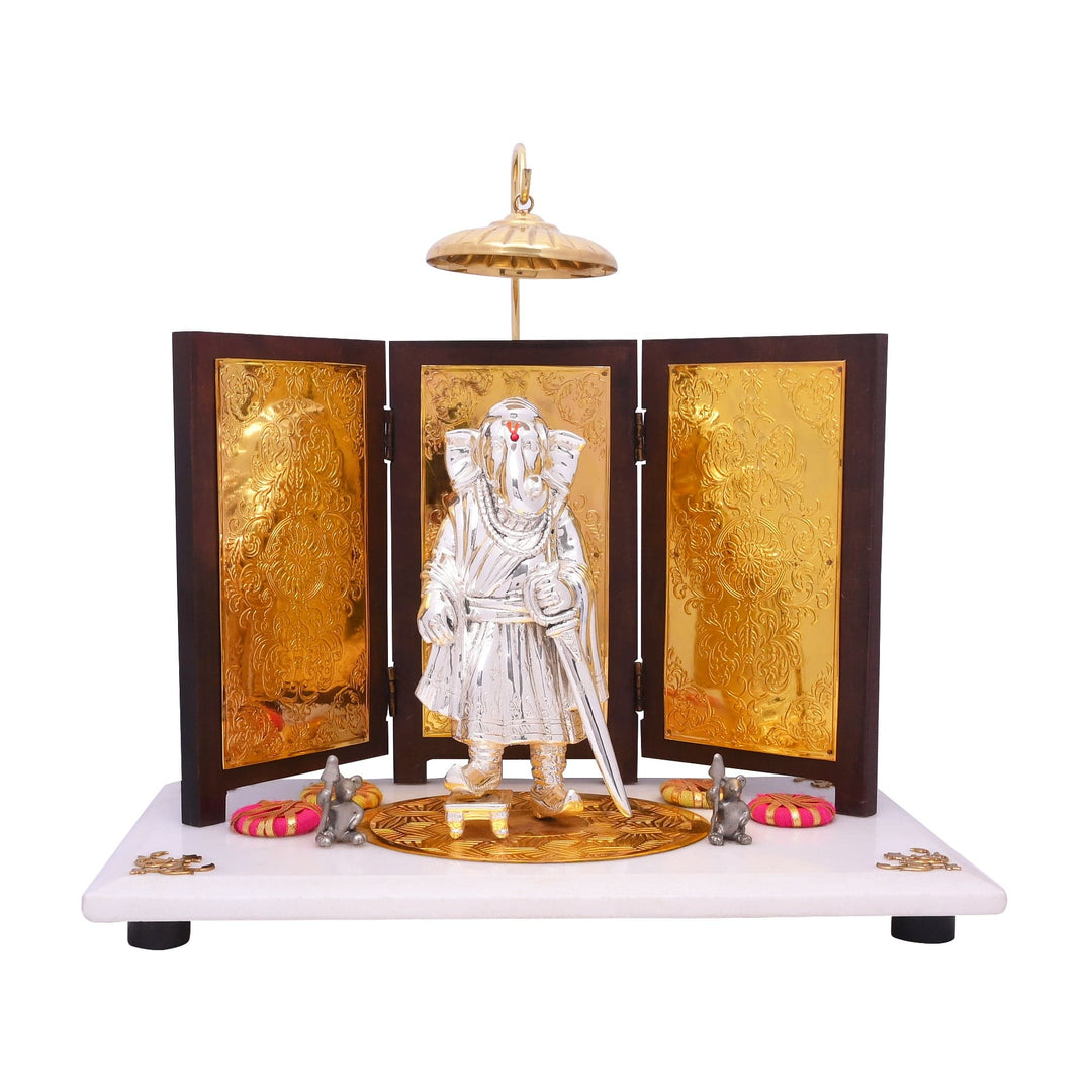 Ganesh Maharaja is a sterling silver Ganesha idol cast as a standing warrior king, dressed in flowing robes and holding a sword - white background