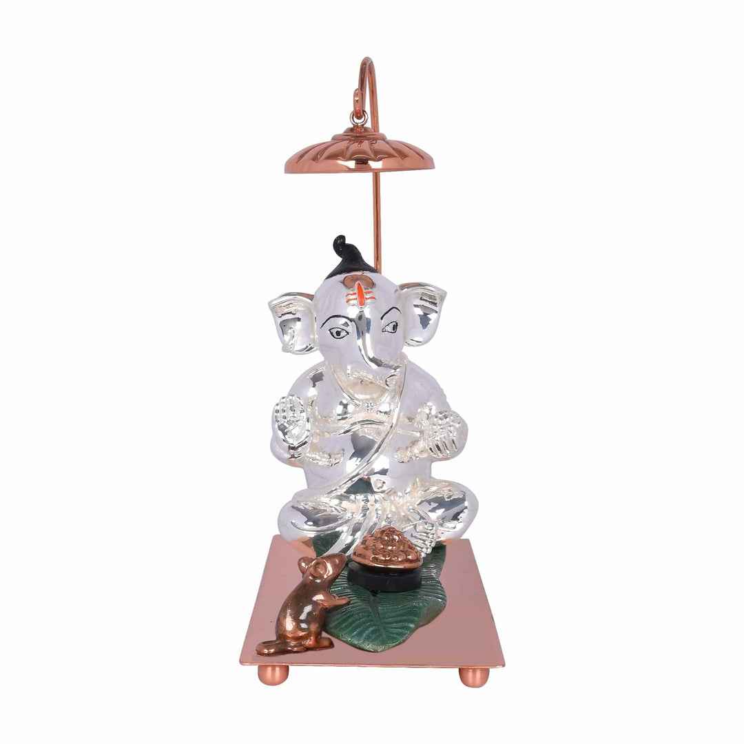 Ganesh Pandit is a sterling silver Ganesha idol marked by painted eyes and a red tilak - white background