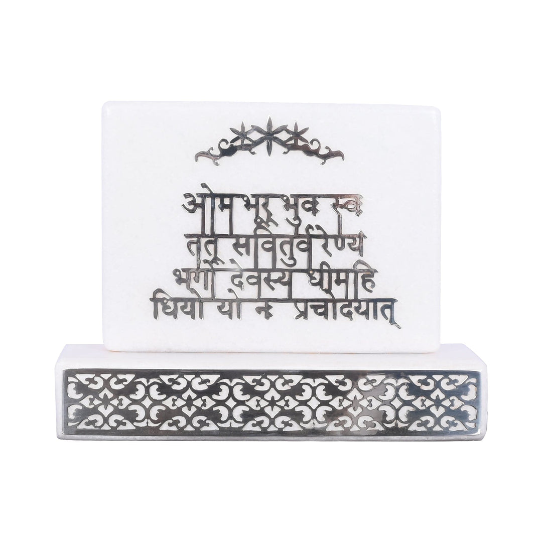 Gayatri Mantra on Stone sets a sterling silver plaque with the Gayatri Mantra in raised Devanagari script into a polished white stone block - white background