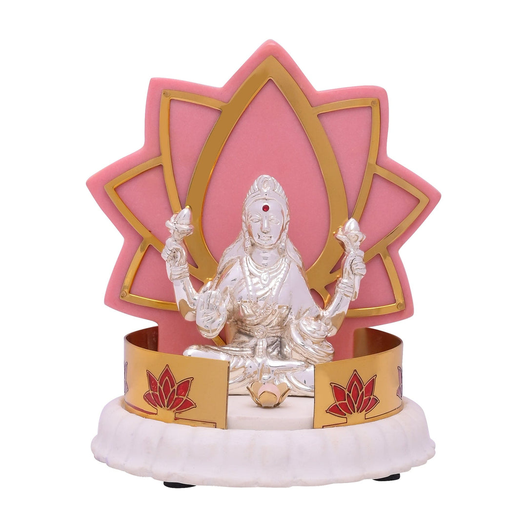 Padmalaya Laxmi is a sterling silver Lakshmi idol sitting cross-legged - white background