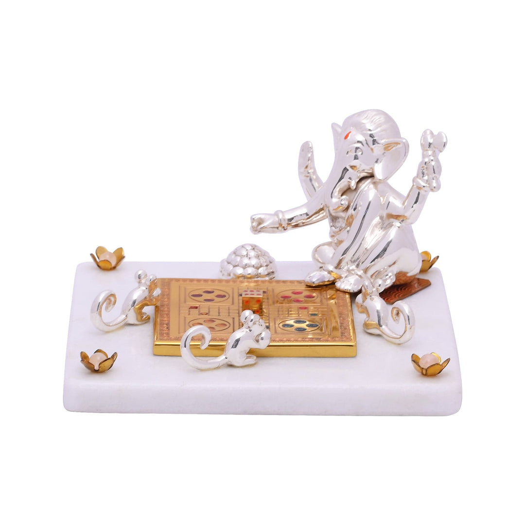 Ganesh Siddidata is a sterling silver Ganesha idol seated at play - white background