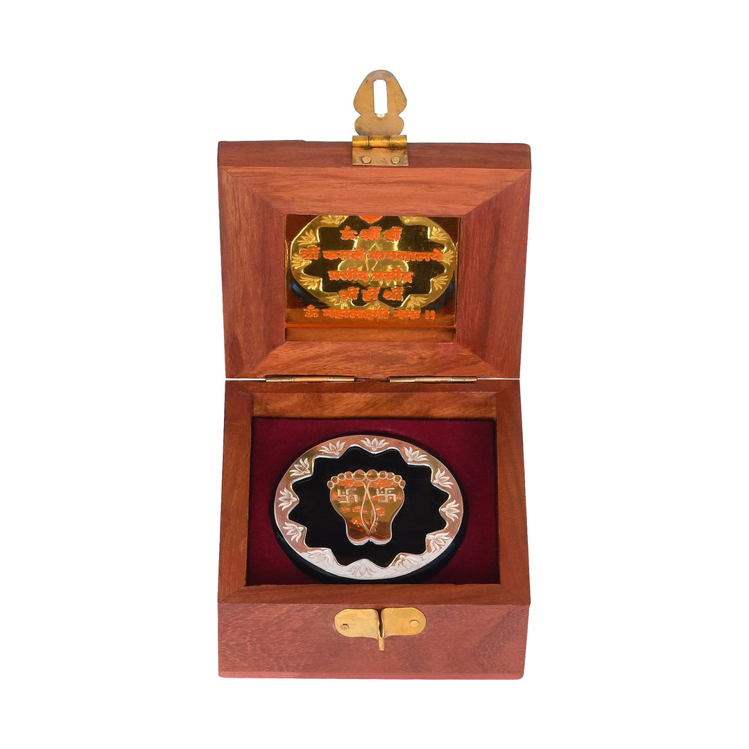 Laxmi Feet Floral centres on a sterling silver coin stamped with a pair of Lakshmi&