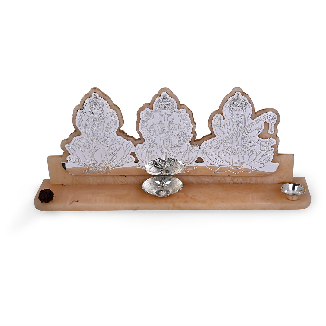 Laxmi Ganesh Sampoorna Kripa arranges Lakshmi, Ganesha and Saraswati as three upright silver plaques - white background