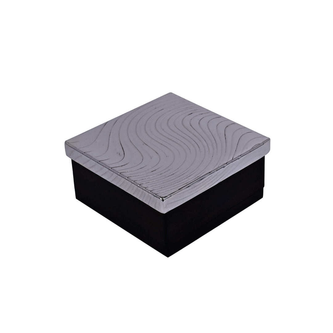 Fluid Box is a silver trinket box carrying a sculptural wave pattern - white background