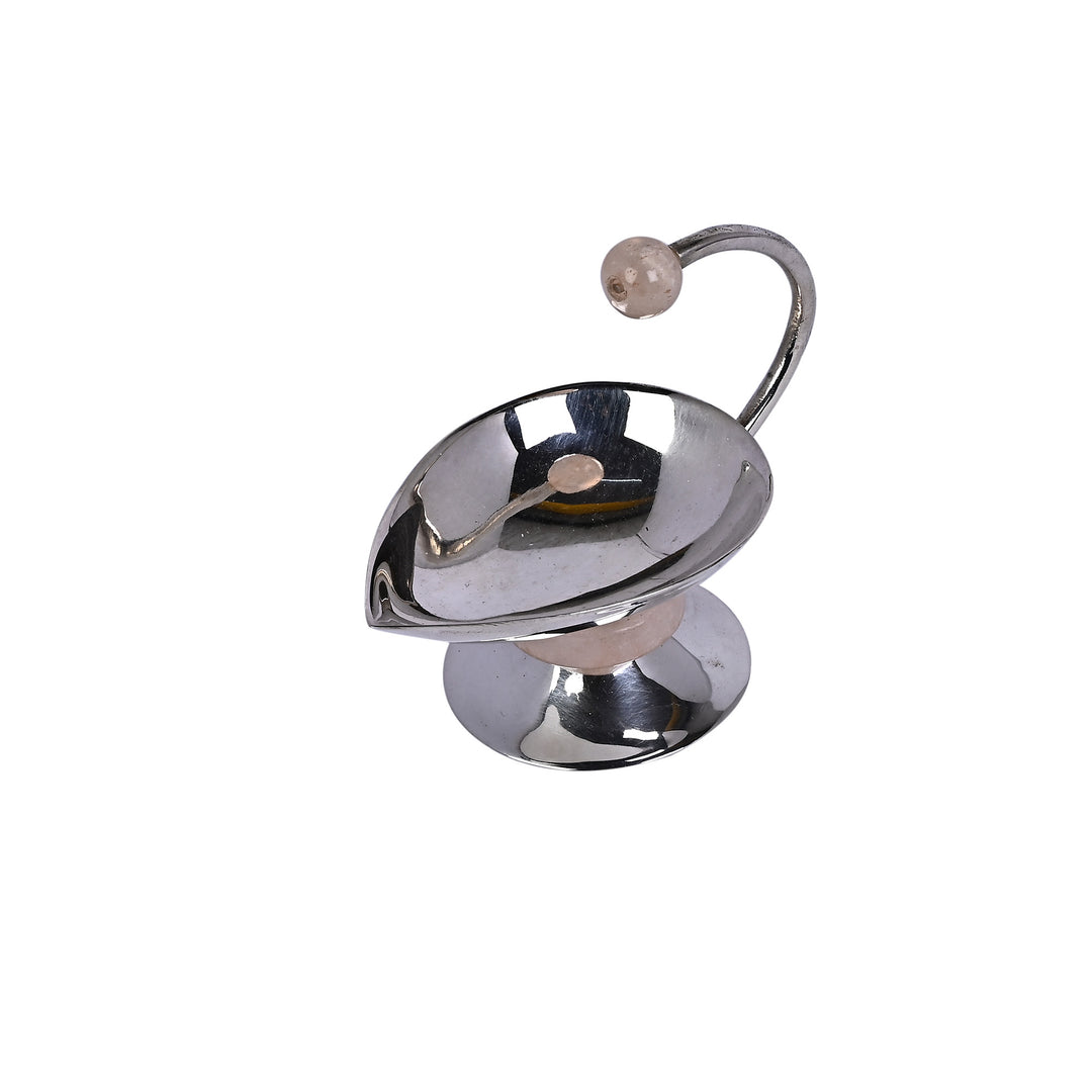 Shashwat Diya is a silver diya shaped like a single curved leaf - white background