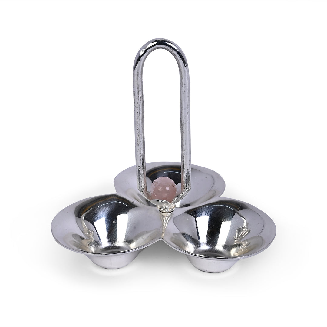 Pooja Tilak Set is a three-lobed silver tilak holder with sindoor, rice, and tilak powder in separate scalloped bowls - white background