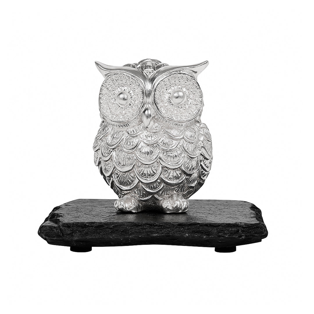 Owl Hedwig is a silver figurine of a round, big-eyed owl standing on a rectangular black slate base - white background