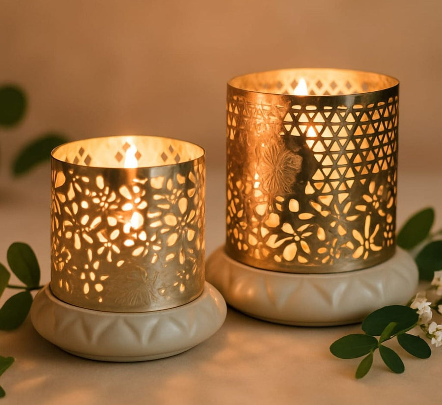 Two silver votives lit for Diwali