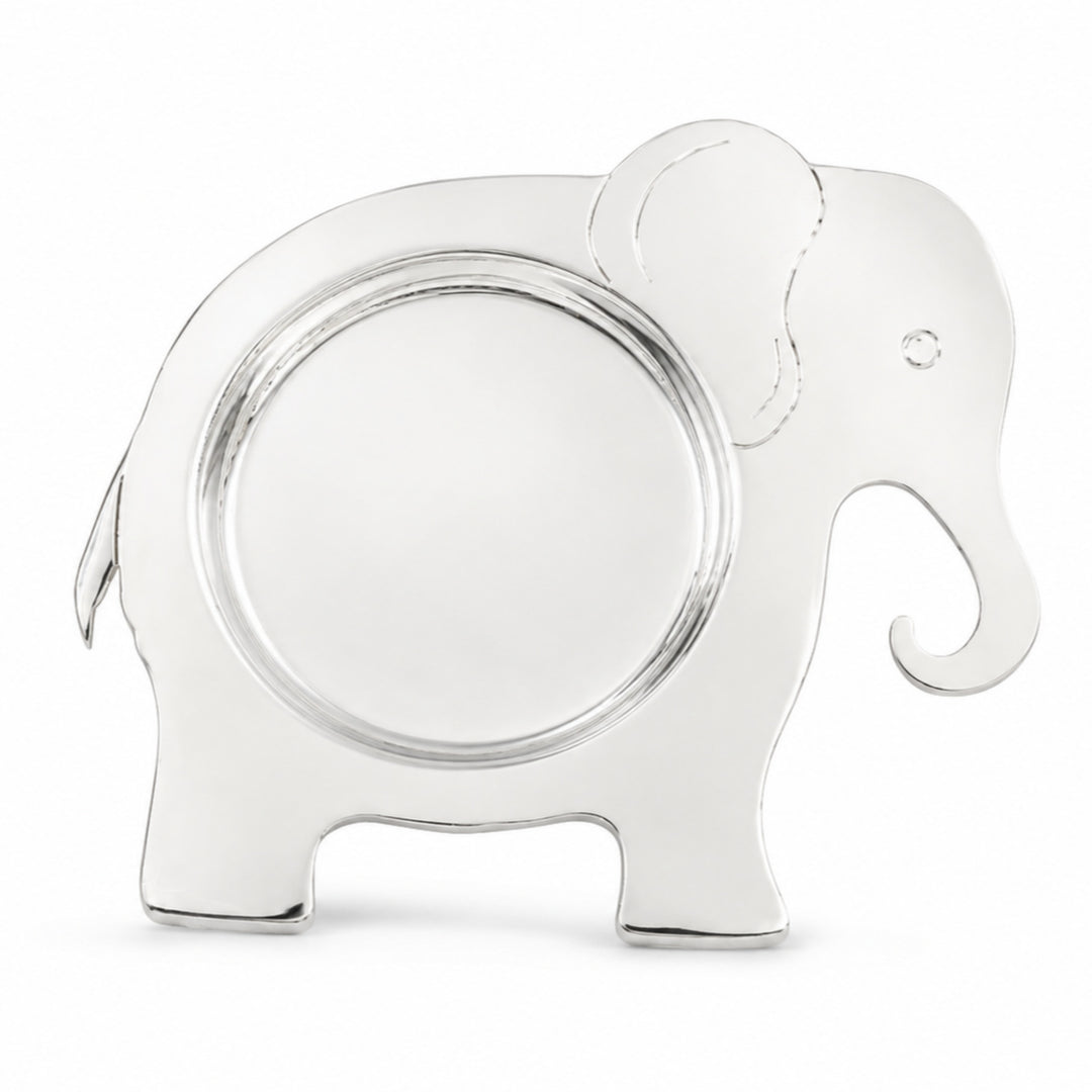 Elephant Baby Thali is a silver feeding thali cut to the outline of a standing elephant, with a round well recessed into its mirror polished body. - white background