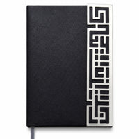 Enigma Diary is a silver diary carrying a geometric maze fretwork strip along one edge of a black leatherette cover. - white background